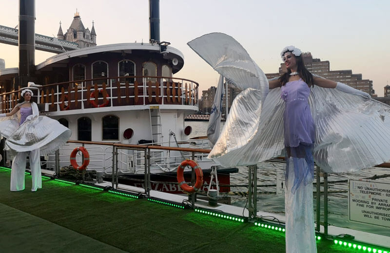 thames luxury charters 2019 spring cruise butlers wharf pier stilt walkers